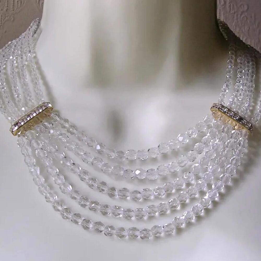 Brand New long faux Crystal beaded Necklace with rhinestone and layered details.